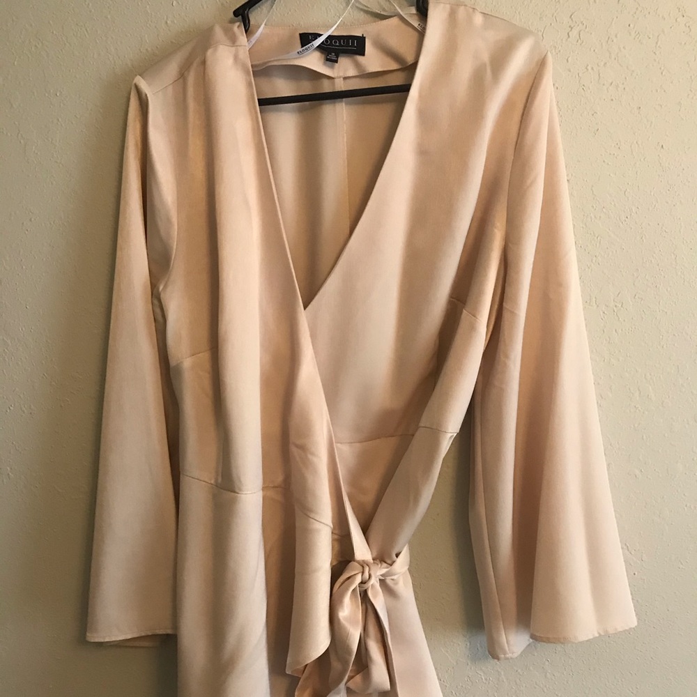 Cream colored, satin top.